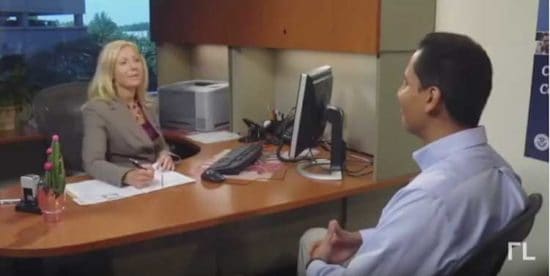 woman interviews man in citizenship test