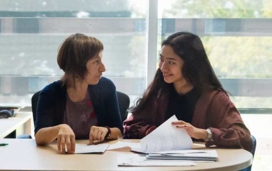 young woman talking to a counselor