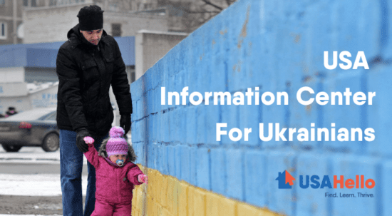 usa information center for ukrainians typed over wall with father and child walking